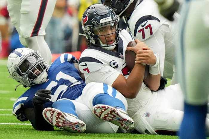 Indianapolis Colts defensive end Kwity Paye (51) smiles after bringing down Houston Texans quarterback C.J. Stroud (7) on Sunday, Sept. 17, 2023, during a game against the Houston Texans at NRG Stadium in Houston